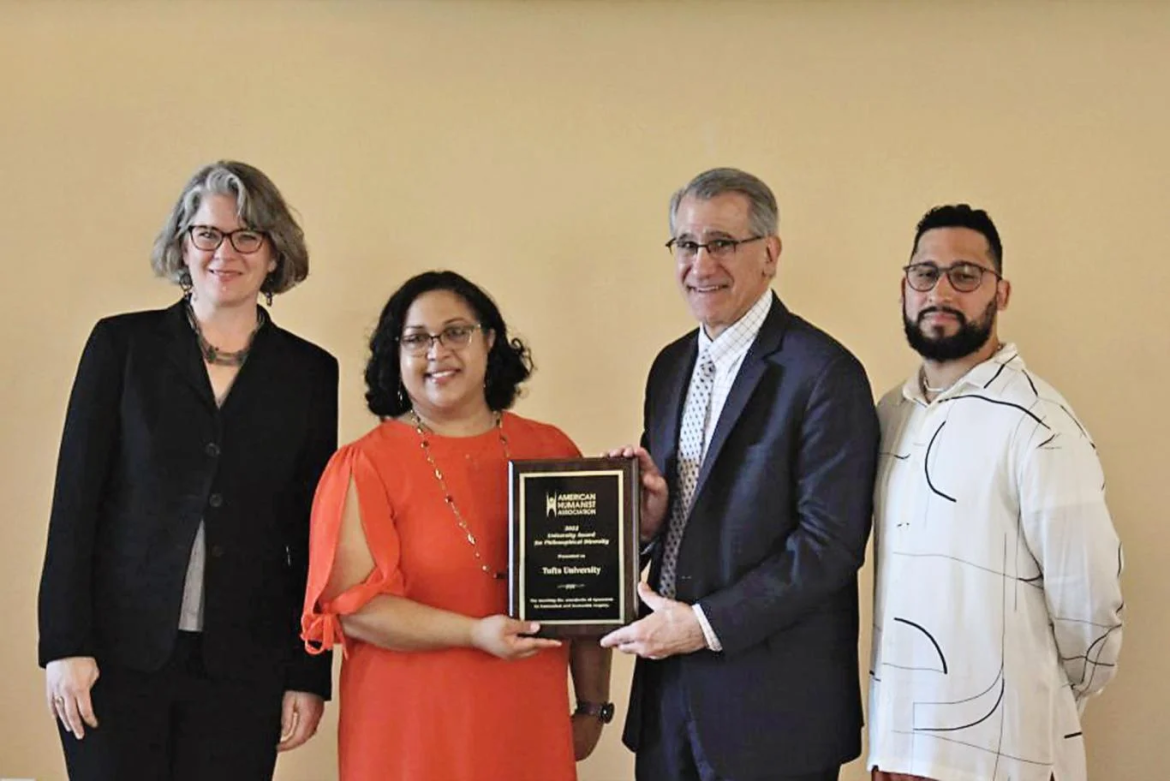 Nadya Dutchin is pictured presenting Elyse Nelson Winger, Anthony P. Monaco and Anthony Cruz Pantojas with the University Award for Philosophical Diversity in Breed Memorial Hall on Nov. 2nd, 2022. Photo: Ilsiia Shakirova / The Tufts Daily